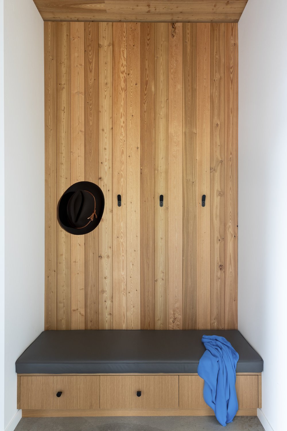 New entryway ideas direction combining warm modern console and mirror, compact bench with wall hooks, dark sculptural lighting